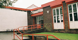 A red brick building with a white roof and a red brick wall. The building has a red brick archway and a red brick wall. The building is made of red bricks. The building has a red brick wall. The building is made of red bricks. The building has a red brick wall. The building is made of red bricks. The building has a red brick wall. The building is made of red bricks. The building has a red brick wall. The building is made of red bricks. The building has a red brick wall. The building is made of red bricks. The building has a red brick wall. The building is made of red bricks. The building has a red brick wall. The building is made of red bricks. The building has a red brick wall. The building is made of red bricks. The building has a red brick wall. The building is made of red bricks. The building has a red brick wall. The building is made of red bricks. The building has a red brick wall. The building is made of red bricks. The building has a red brick wall. The building is made of red bricks. The building has a red brick wall. The building is made of red bricks. The building has a red brick wall. The building is made of red bricks. The building has a red brick wall. The building is made of red bricks. The building has a red brick wall. The building is made of red bricks. The building has a red brick wall. The building is made of red bricks. The building has a red brick wall. The building is made of red bricks. The building has a red brick wall. The building is made of red bricks. The building has a red brick wall. The building is made of red bricks. The building has a red brick wall. The building is made of red bricks. The building has a red brick wall. The building is made of red bricks. The building has a red brick wall. The building is made of red bricks. The building has a red brick wall. The building is made of red bricks. The building has a red brick wall. The building is made of red bricks. The building has a red brick wall. The building is made of red bricks. The building has a red brick wall. The building is made of red bricks. The building has a AI generated content