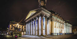 A large building with a clock tower and a blue and white facade. AI generated content