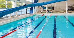 Swimming pool with people in it. AI generated content